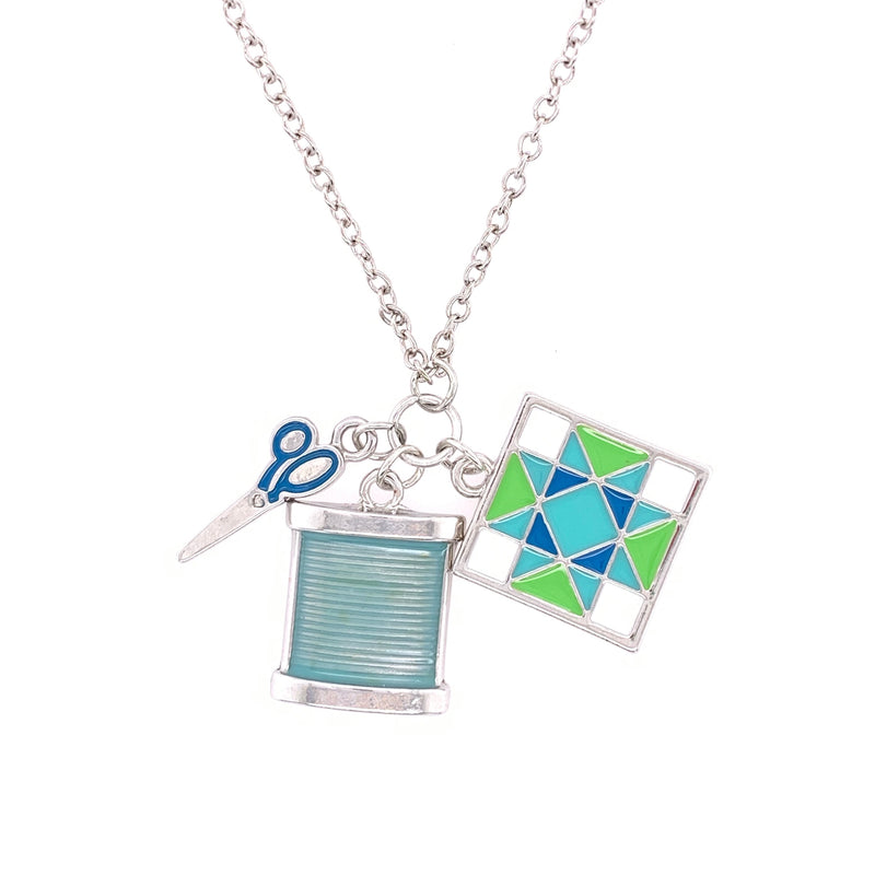 Silver Necklace with Aqua Sewing Charms Dangle